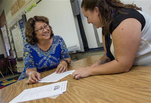 Teachers collaborating in a school 