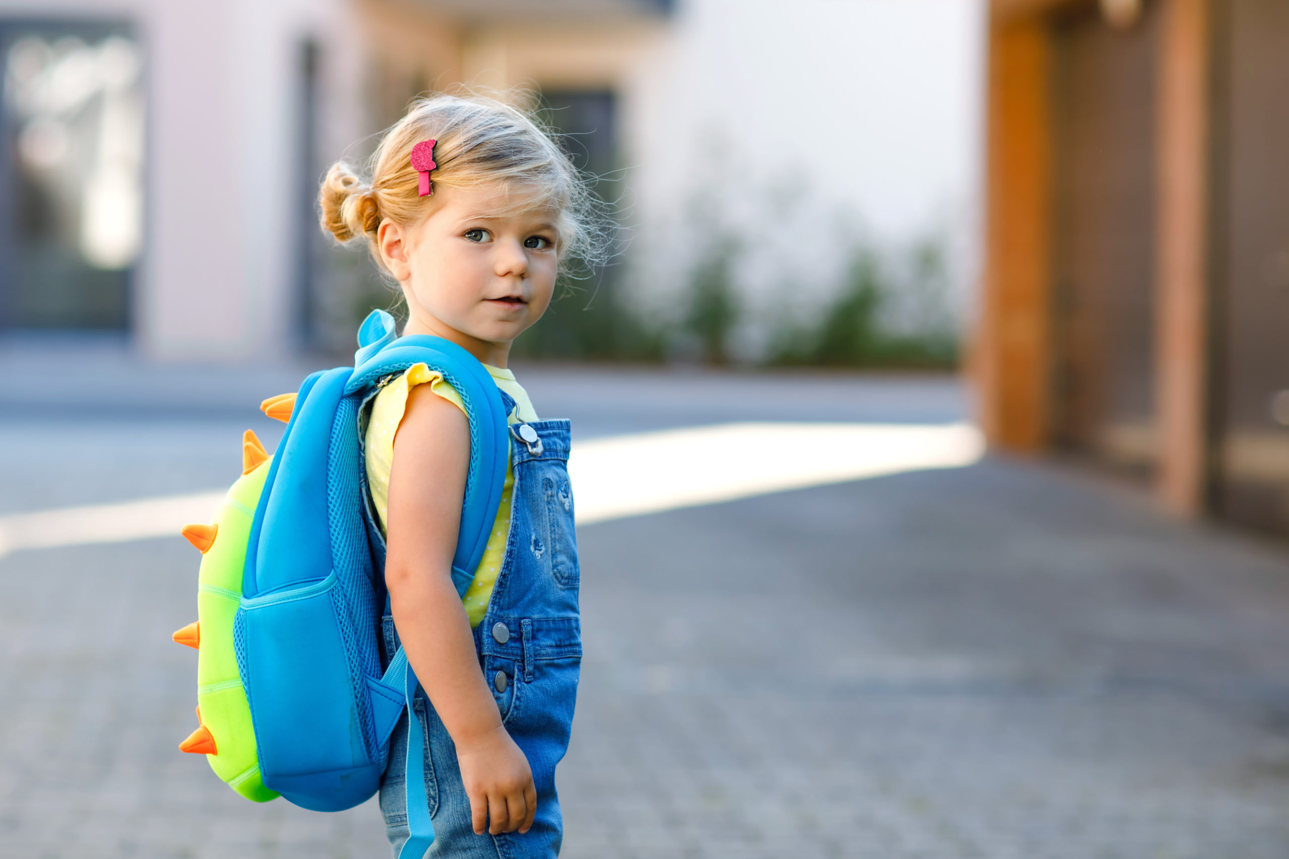 Child with backpack on first day of Kindergarten.